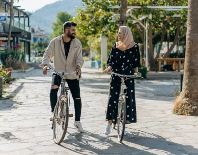 man and woman riding on bicycles